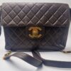 Sac à dos Timeless Chanel en cuir marron matelassé .
