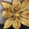 Broche pendentif Yves Saint Laurent en métal doré