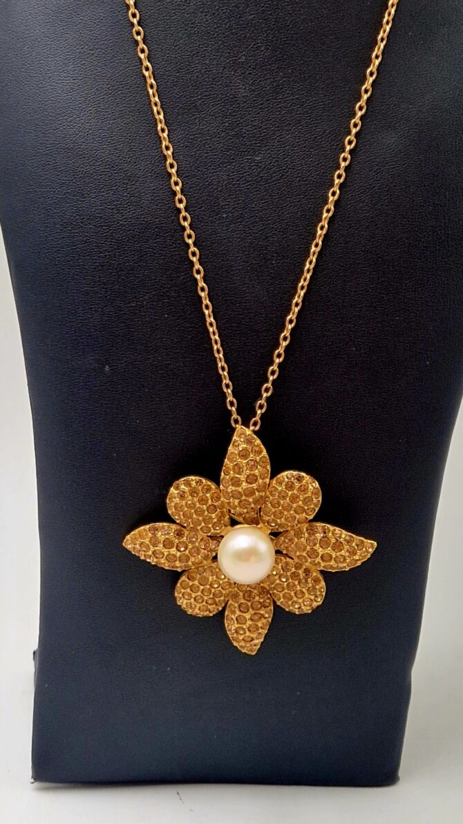 Broche pendentif Yves Saint Laurent en métal doré