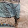 Vue du centre du carré Hermès Cent Plis des Miao, création de 2010 par Aline Honoré. Le motif évoque les plis concentriques des costumes traditionnels