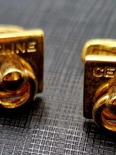 Boutons de manchette Céline vintage carrés en métal doré.
