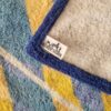 drap de bain Hermès représentant les parasols de deauville - étiquette intérieure