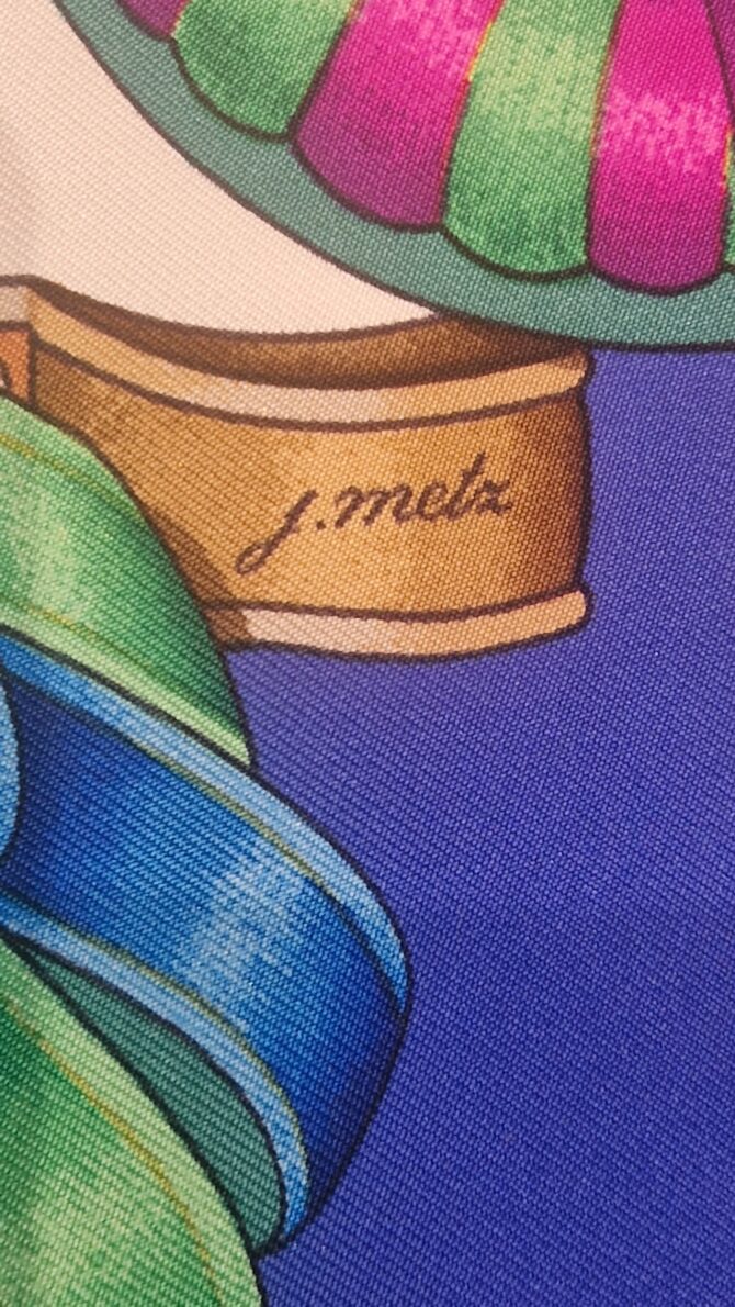 Signature de l’artiste J. Metz sur le carré Hermès Les Rubans du Cheval.